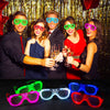 Group of five people wearing various colored LED light-up glow glasses for a party photo