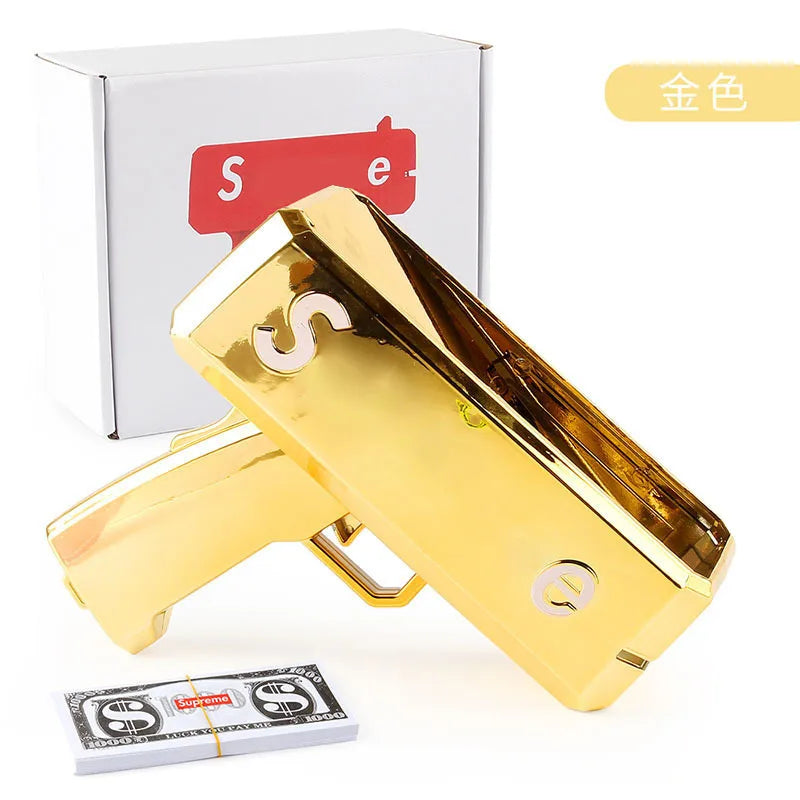 A gold-colored funny money shooter toy is shown next to its packaging and a stack of money.