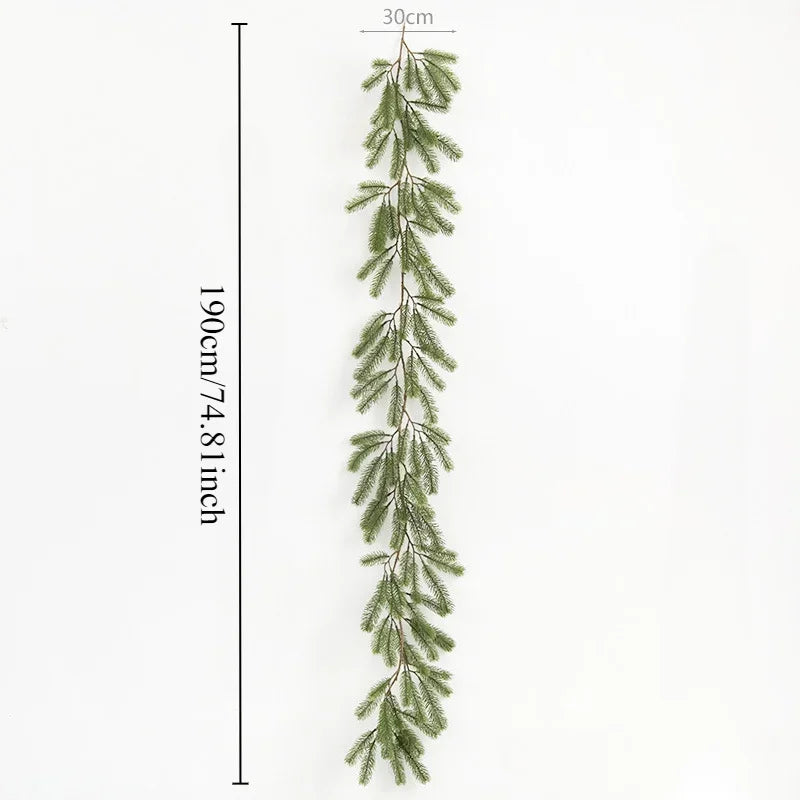 A long, slender artificial pine garland with green needles displayed against a white background.