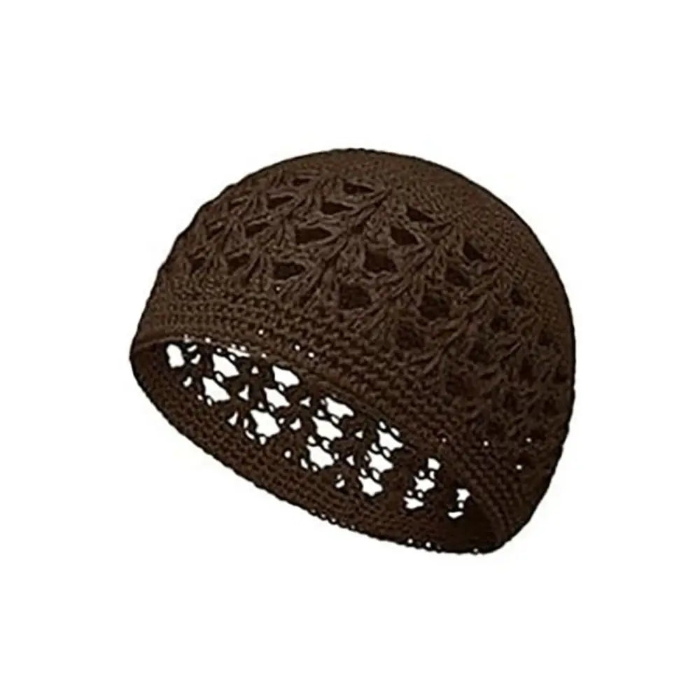 A dark brown handmade crochet beanie hat with an openwork pattern.