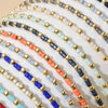 Handmade boho glass bead bracelet with adjustable cord featuring various colors like black, gold, blue, and orange.