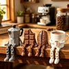 A set of 3D printed coffee bean cup figurines with articulated joints displayed on a wooden surface.