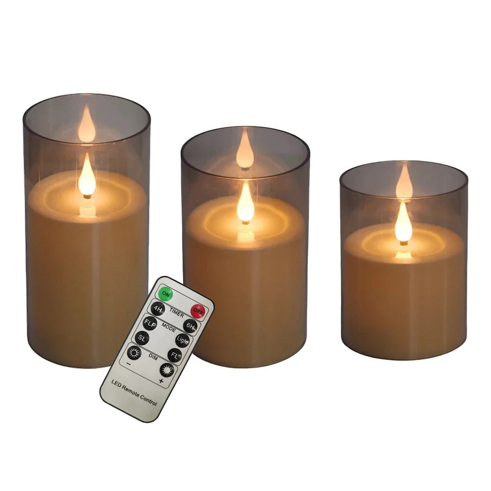 Three amber-colored flameless LED candles in glass holders with visible flame tips and a remote control.
