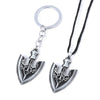 Silver arrow metal keychain with a detailed trident design and black cord