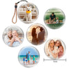 A collection of round holographic crystal ball video players showing various scenes like a dog, a couple, and a family.