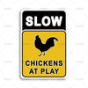 A black and yellow warning sign with the text SLOW CHICKENS AT PLAY.