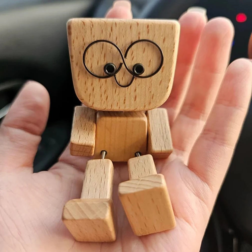Handmade wooden shaking figure with magnetic expressions featuring a stylized face.