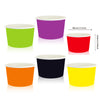 A collection of solid color disposable paper food trays in purple, green, red, orange, and yellow.