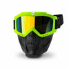 A pair of neon green full face skull riding goggles with a black strap and tinted lenses.
