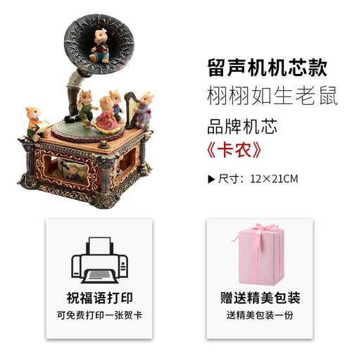 A decorative music box featuring a carousel theme, displayed on a wooden stand.