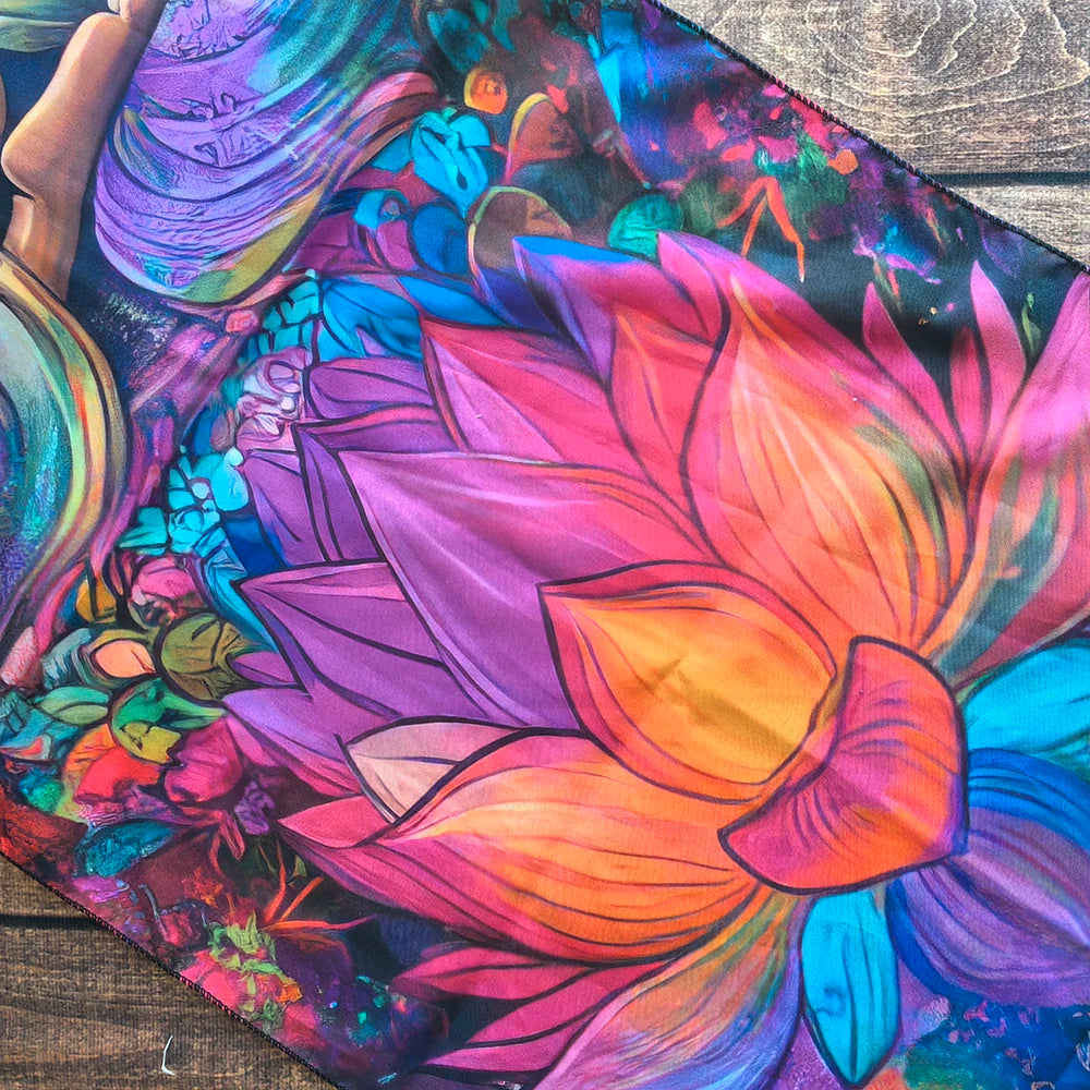 A vibrant tapestry featuring a large pink and orange lotus flower with purple and blue accents.