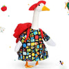 A white goose statue with a red beak and a black shirt decorated with colorful patterns.