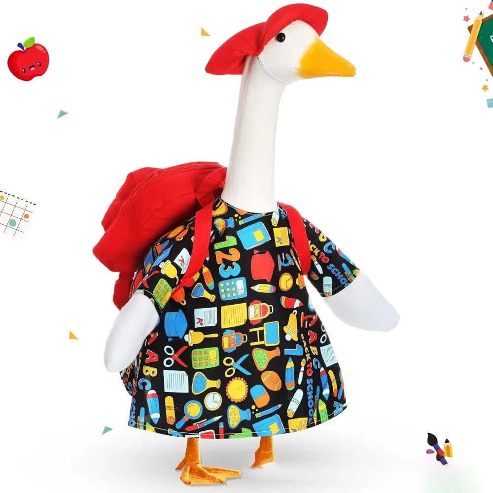 A white goose statue with a red beak and a black shirt decorated with colorful patterns.