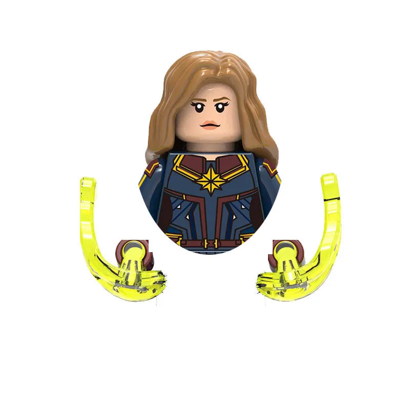 A building block figure of a female character with long brown hair wearing a dark blue and gold outfit and holding yellow ear