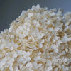 A close-up of a large cluster of white dried hydrangea florets used for home decor.