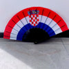 A handheld folding fan decorated with the flag of Croatia, featuring red and white stripes.