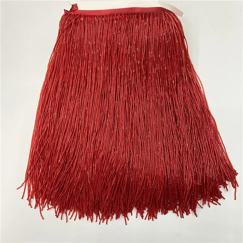 A vibrant red tassel fringe trim for curtains or DIY projects, displayed flat.