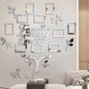 A set of acrylic 3D wall art decals shaped like leaves and branches forming a family tree design on a light gray wall.