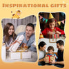 A family is shown gifting a crocheted Highland cow keychain keepsake to a child.