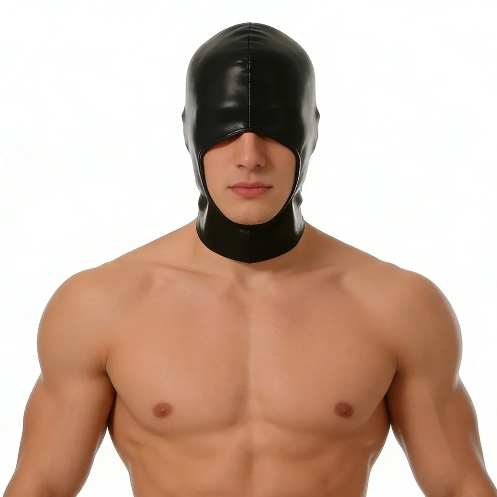 A male model wearing a black faux leather hood mask with blindfold.