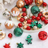A collection of colorful shatterproof Christmas ball ornaments including gold, silver, and red finishes.