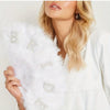 A woman holds a white feather hand fan decorated with rhinestone letters B, R, I, D, E.