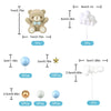 A set of baby shower cake toppers featuring a teddy bear, star, and various round decorations in blue, gold, and white.