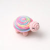 Handmade crocheted turtle plush toy in pink and blue colors.