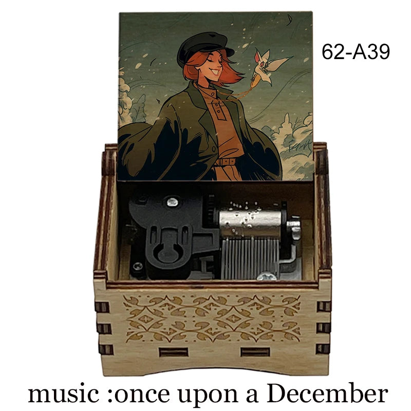 A hand-cranked wooden music box featuring an illustration of a character and a small bird.