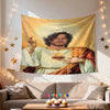 A tapestry wall hanging featuring a depiction of Jesus Christ with a halo against a golden background.