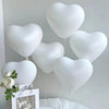 A cluster of white heart-shaped latex balloons is displayed against a white background.