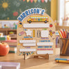 A wooden keepsake board for children with sections like I am, my teacher is, and I love.