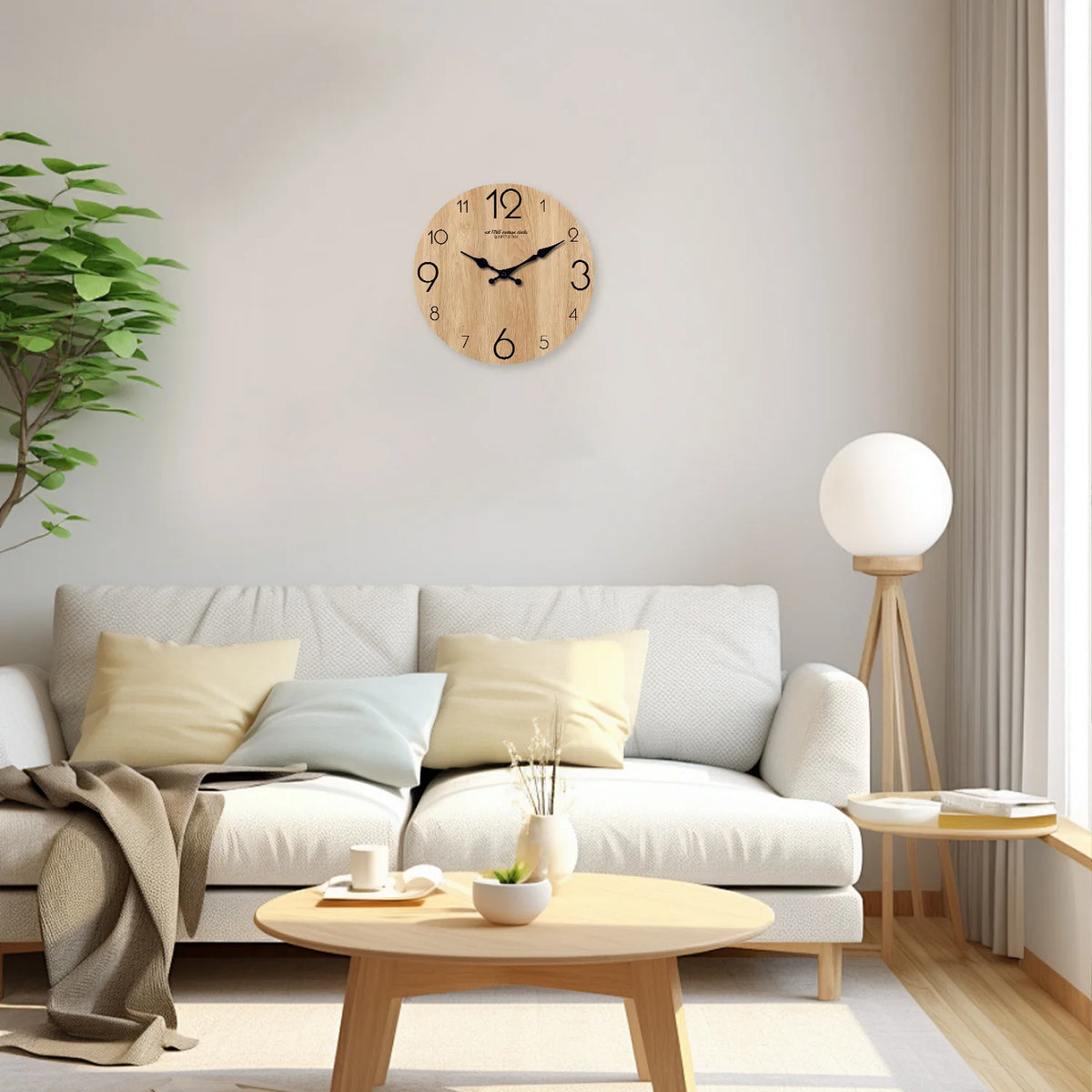 A round wooden wall clock with a clock face hangs on a white wall above a light-colored sofa.