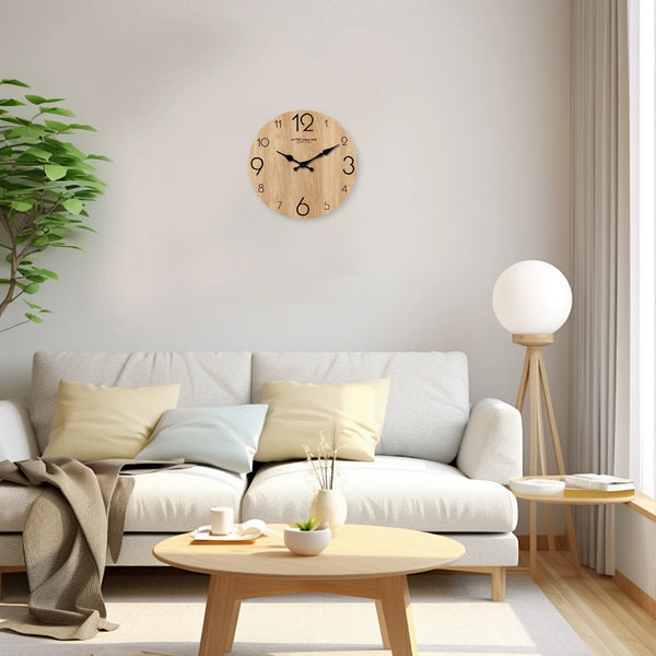 A round wooden wall clock with a clock face hangs on a white wall above a light-colored sofa.
