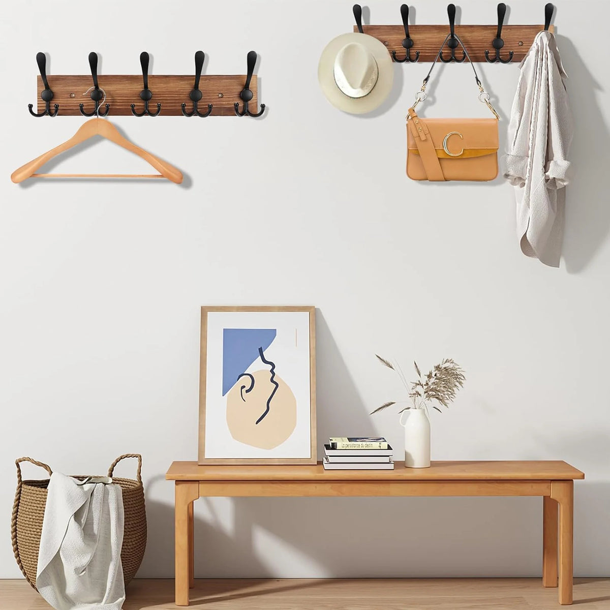 A wooden wall-mounted coat rack with five triple hooks is displayed above a wooden bench.