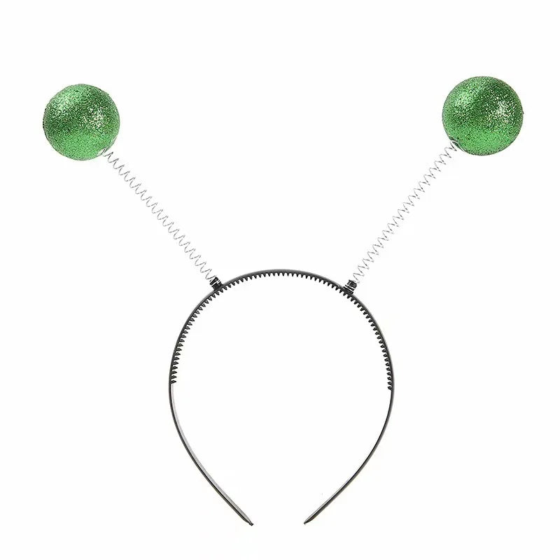 A pair of green glitter sunglasses with a silver chain and hoop frame.