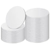 A stack of round white corrugated cake boards for disposable cakes.