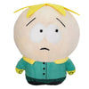 A plush toy of a cartoon character with light skin, yellow hair, and a green shirt.