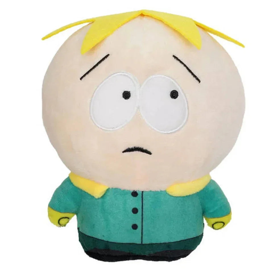 A plush toy of a cartoon character with light skin, yellow hair, and a green shirt.