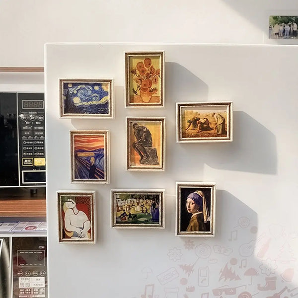 A display of various Van Gogh paintings framed as fridge magnets on a white wall.