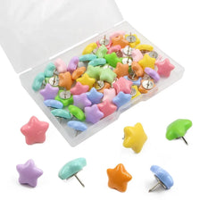 A variety of decorative pentagram thumb tacks in various colors including pink, yellow, green, and purple are displayed in an