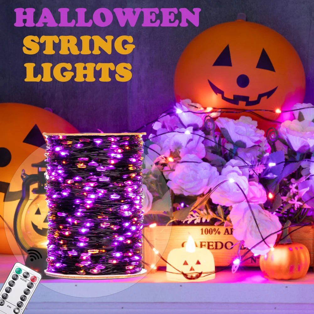 A bundle of purple fairy string lights is displayed next to a carved pumpkin and white flowers.