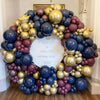 A balloon garland featuring metallic gold and navy blue balloons for a party decoration