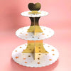 A three-tier gold and white cupcake stand for dessert tables and party displays.