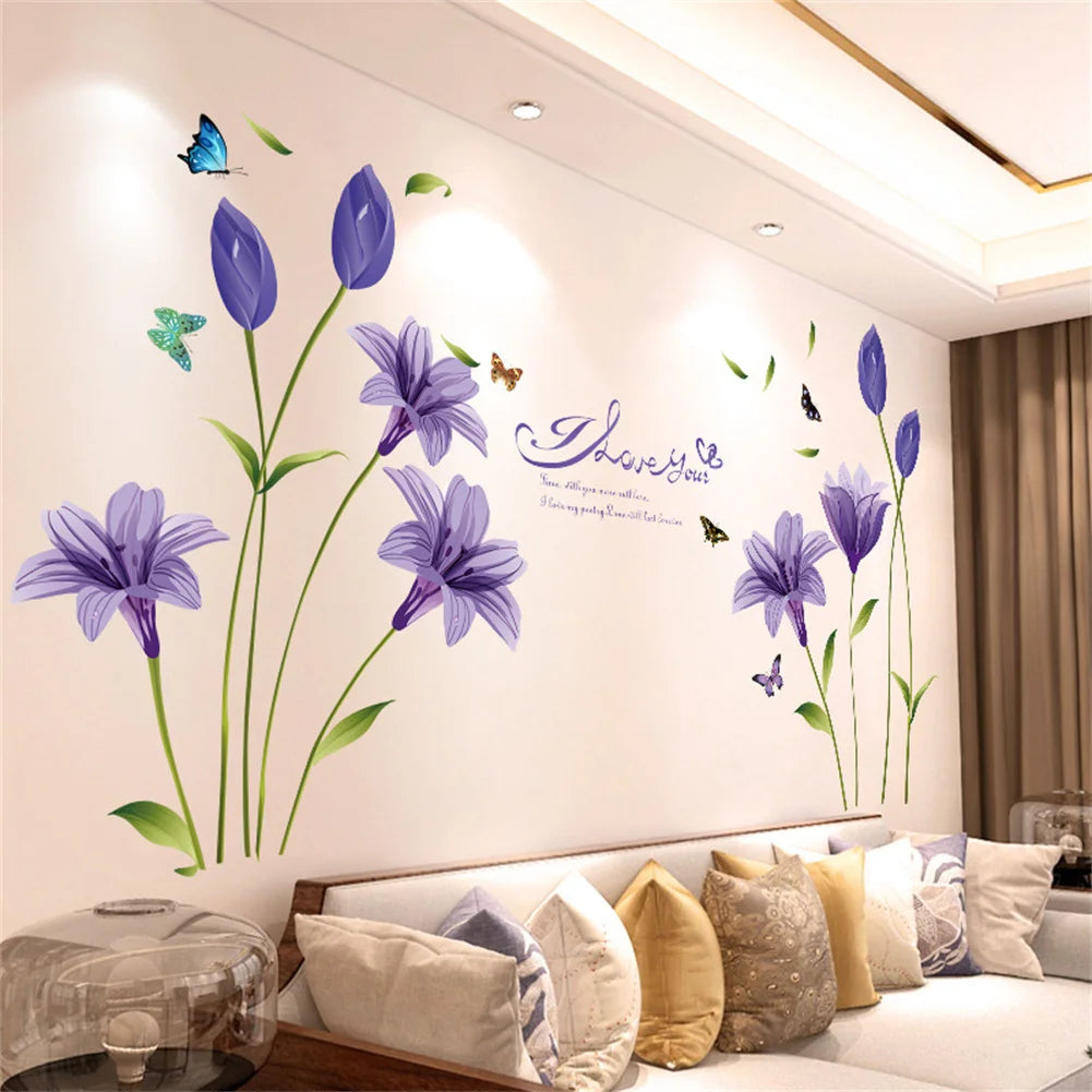 Purple and blue floral wall stickers featuring flowers and butterflies on a white wall.