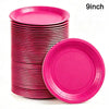 A stack of pink disposable paper plates with one plate displayed separately.