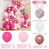A large arrangement of pink and rose gold latex balloons in various sizes and colors for celebrations