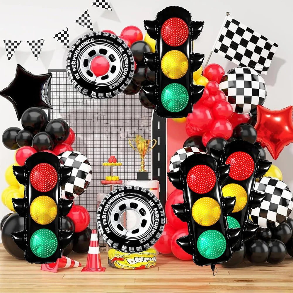 A set of black and red race car traffic light balloons with checkered patterns and various colored balloons.