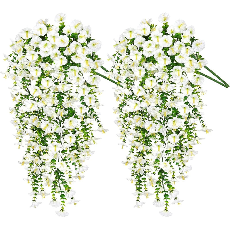 A pair of artificial morning glory hanging vines with white flowers used for home and wedding decor.