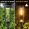 A pair of black solar pathway lights, one showing auto off at dawn and the other auto on at night.